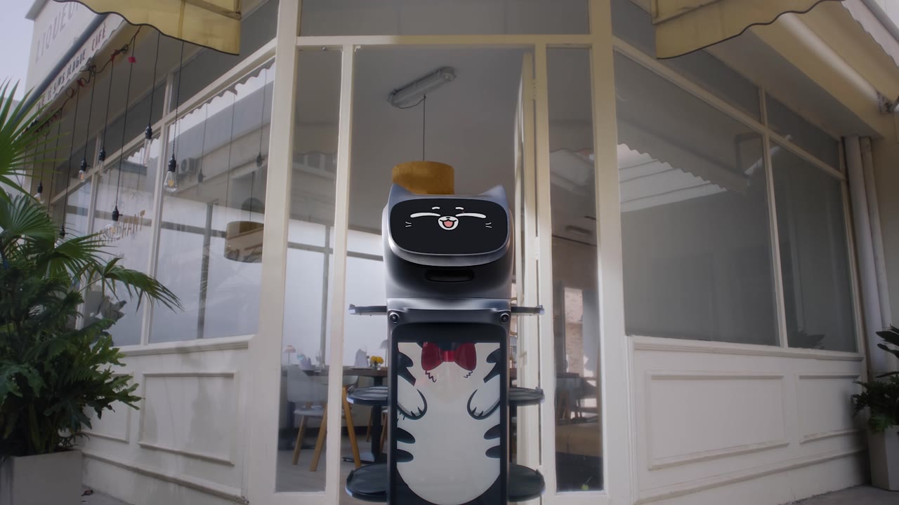 PUDU BellaBot Pro delivery robot carrying trays through a restaurant dining room